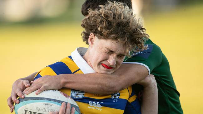A Sydney Uni player getting plenty of attention in the under 18s.