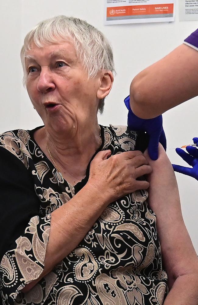 Jane Malysiak, 84, reacts as she becomes the first person in Australia to receive a Pfizer/BioNTech COVID-19 vaccine. Picture: Steven Saphore / AFP