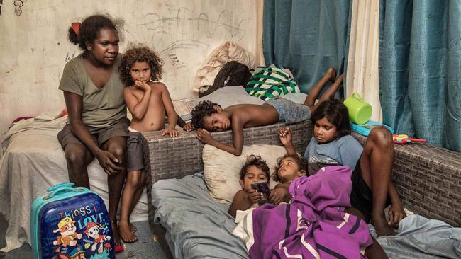 Shaylene Yarrick with her five children and other kids that sleep inside their two bedroom Mornington Island house that regularly hosts twenty residents. Picture: Brian Cassey