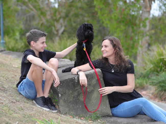 Lynne Stewart and son Alex with their dog Charley after "eight weeks of hell" in the UK. Picture Glenn Hampson