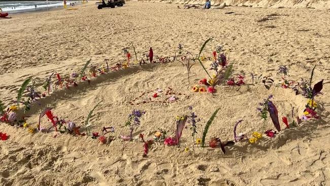 A beach tribute to Kaison Greaves, 9, who died after becoming stuck between rocks off the shoreline at South West Rocks. Picture: ABC