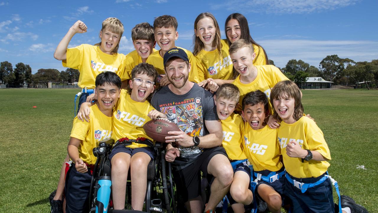 Kidman Park Primary School NFL Flag coaches Sean Yates-Bock and Alex Kouts with their team. Picture: Mark Brake