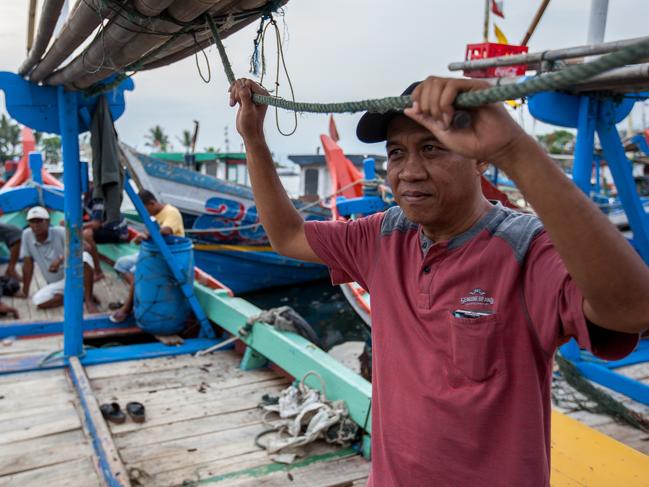 13 February 2019,Pelabuhan Ratu,Sukabumi Regency, West Java, Indonesia. Local fisherman Yosep on his boat at the crowded fishing port at Pelabuhan Ratu. His brother has been jailed in Australia on charges of people smuggling from the area. Now  local fisherman say that people smugglers have not been active in the area for a long time in the wake of the Australian Government's concern that boats will once again start trafficking people to Australia with the new Medical legislation that has been passed. Picture by Graham Crouch/The Australian