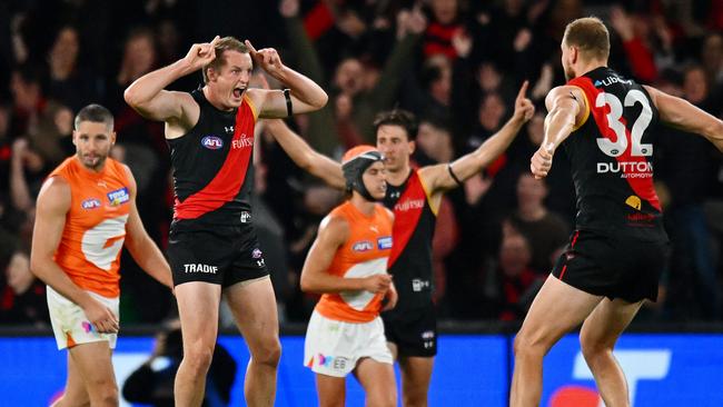 MELBOURNE, AUSTRALIA - MAY 11: Mason Redman of the Bombers celebrates a goal during the round nine AFL match between Essendon Bombers and Greater Western Sydney Giants at Marvel Stadium, on May 11, 2024, in Melbourne, Australia. (Photo by Morgan Hancock/AFL Photos/via Getty Images)