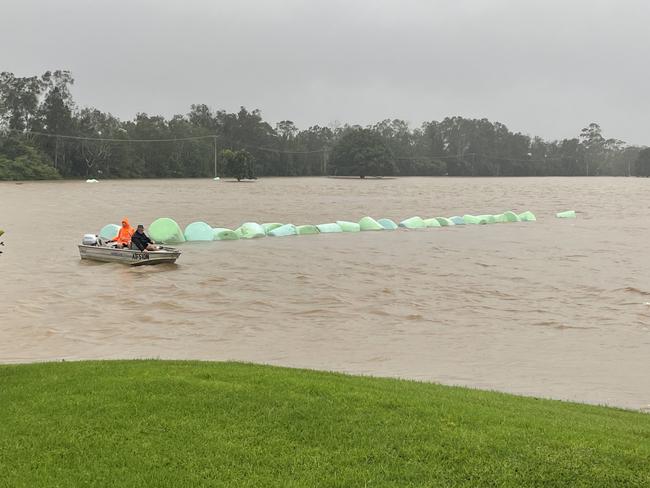 A Mid North Coast farmer, Stuart Redman, has been forced to herd cattle by kayak and watch his 89 year old grandfather's cabin wash away, as devastating floods return to the region for the second time in four years. Picture: Supplied