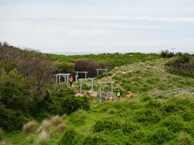 Workers installed surefoot footings to elevate the boardwalk in order to protect the penguins’ habitat and allow them to have unlimited movement. Picture: Supplied