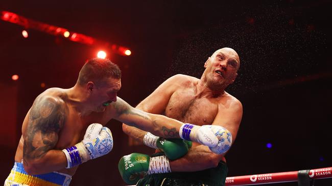 Oleksandr Usyk punches Tyson Fury. Photo by Richard Pelham/Getty Images.