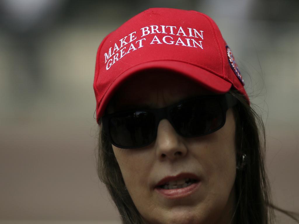 Fans of Donald Trump wait to catch sight of him, outside Buckingham Palace. Picture: AP Photo/Tim Ireland