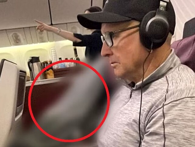 man forced to sit next to corpse