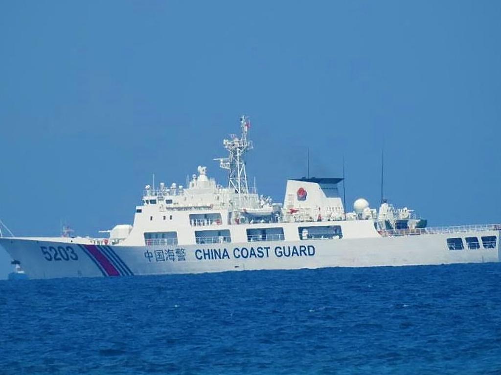 A Chinese coast guard ship sailing along the Whitsun Reef, in the Spratly Islands on April 14. Picture: Philippine coast Guard (PCG) / AFP