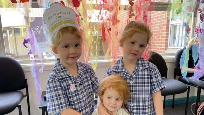 McKenzie Kennedy (4) with her little sister Isla (2) and Riley Kennedy (4), on the first day of prep at Strathfieldsaye. McKenzie and Riley are twins.