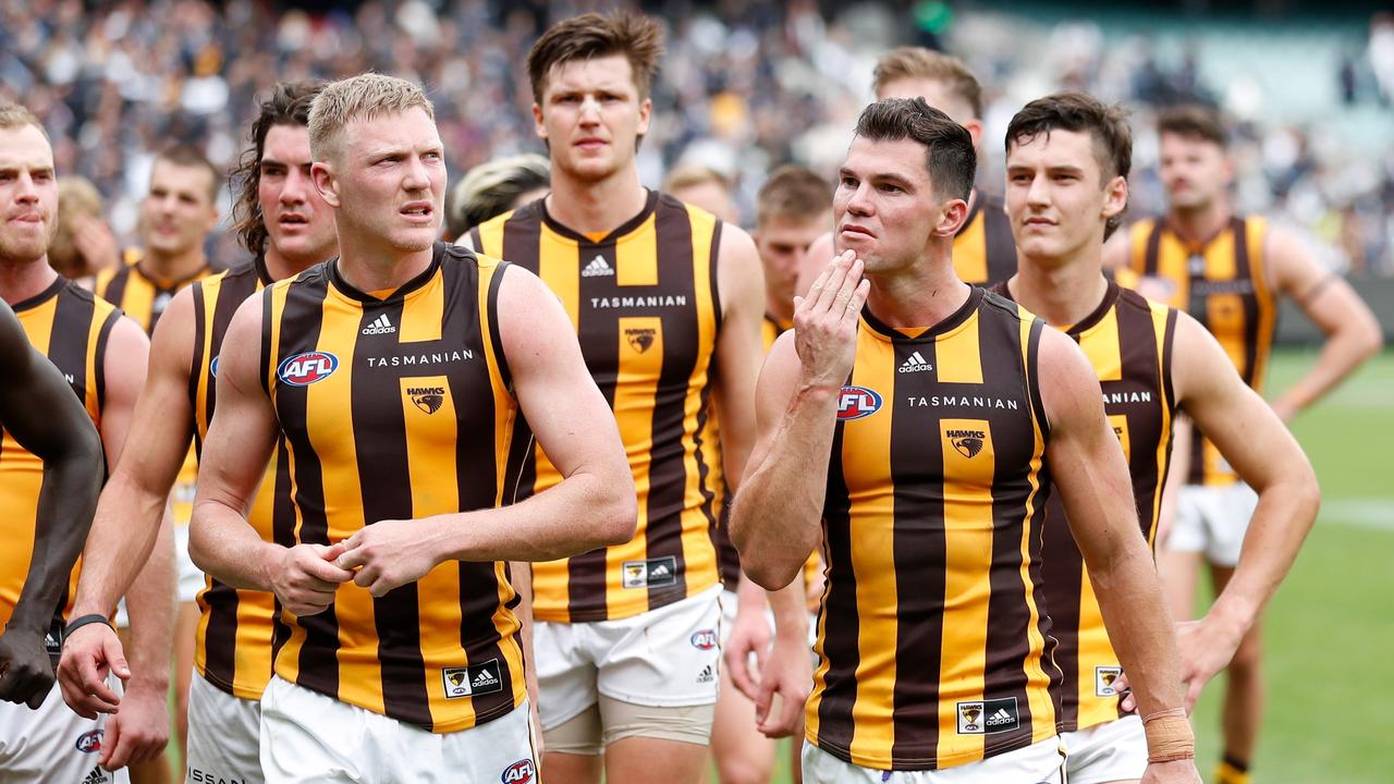 Jaeger O'Meara (front right) and James Sicily (left) walk off the MCG after Sunday’s narrow defeat to Carlton. Picture: Getty Images