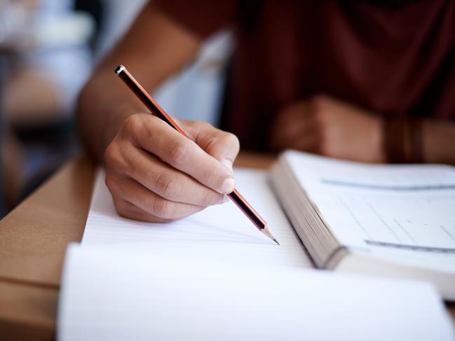 Close up of hands of a student during an exam. Picture: istock