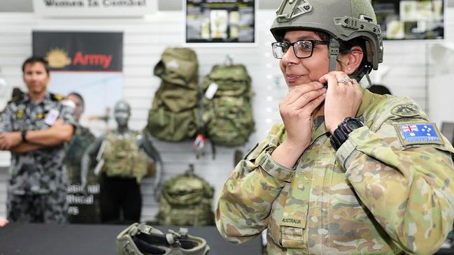 Private Navdeep Gill from the 4th Combat Service Support Battalion tries on the prototype Size 0 helmet and H Back Retention System at the Diggerworks Innovation Hub. Picture: Captain Kristen Cleland