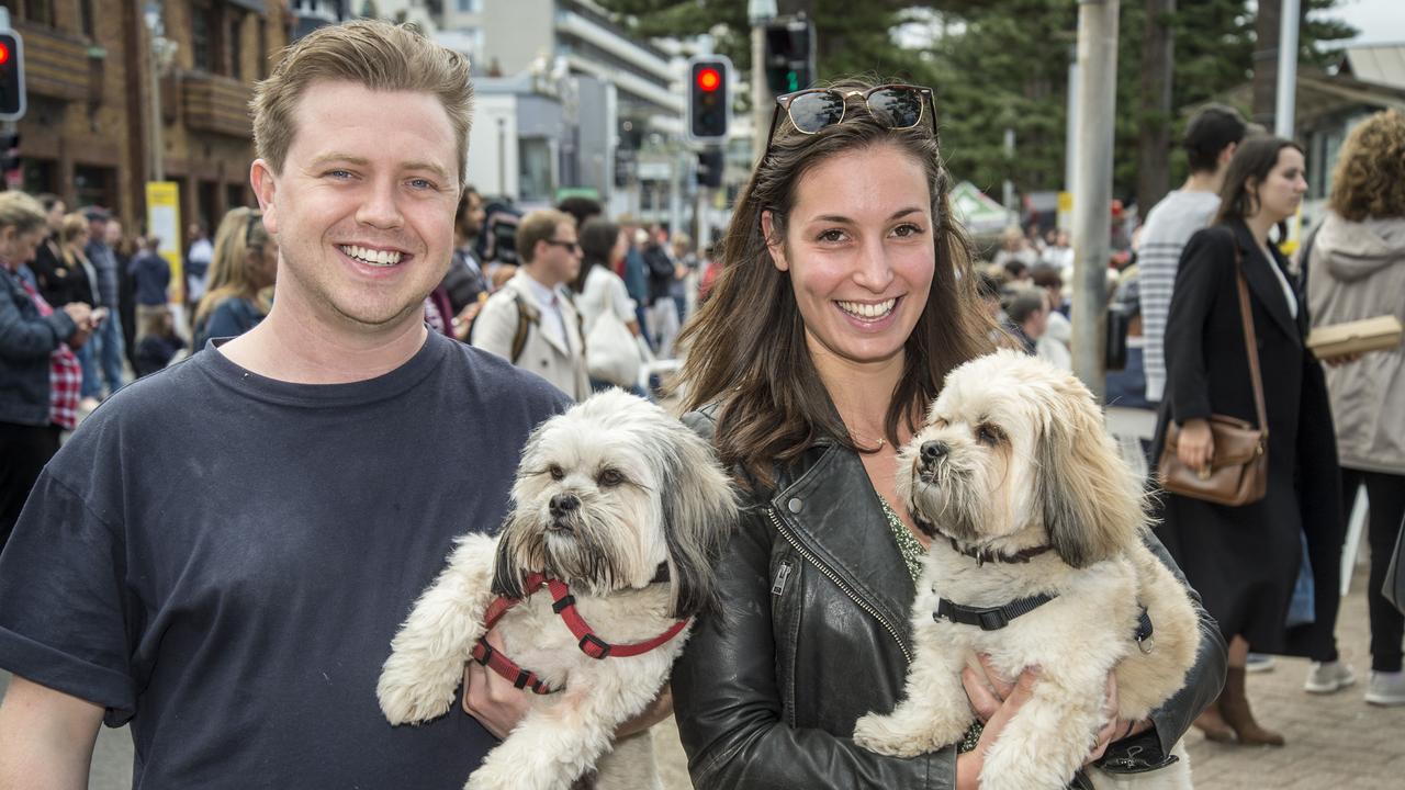 Ryan McCourt and Aimee McElroy pose for a photograph with dogs Beau and Bear during the Manly Jazz Festival Picture: Troy Snook