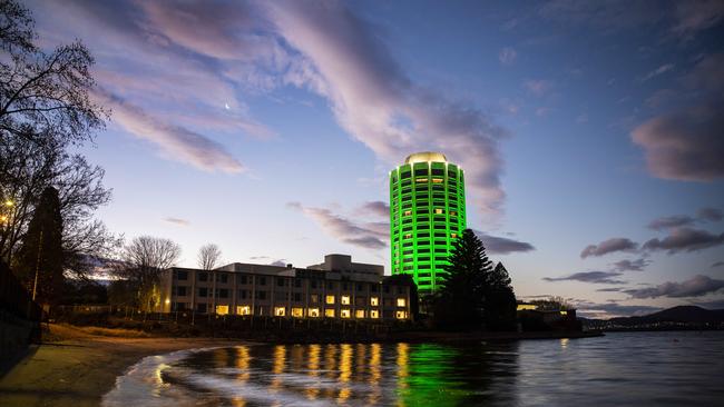 Wrest Point lit up green ahead of the reopening on Friday. Picture: RICHARD JUPE