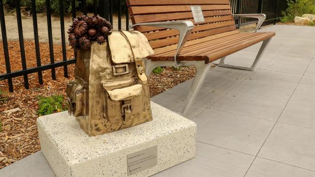 The walking path where Natalie Russell was killed has been transformed in her honour including a bronze sculpture of a school bag adorned with her favourite flowers. Picture: supplied.