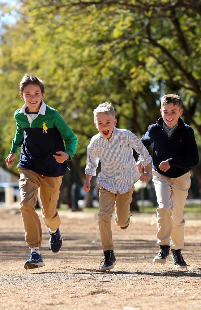 Harry, 12, Hugo, 6, and Max Barwick, 10, were thrilled to meet the PM. Picture: Jonathan Ng