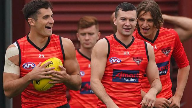 Bombers Mitchell Hibberd, Conor McKenna and Harrison Jones at training on March 5. Picture: Scott Barbour)