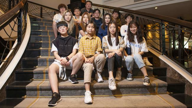 A group of Chinese Students aged between 17 and 20 in Bangkok await permission to return to study in Australia. Picture: Jonathan Taylor