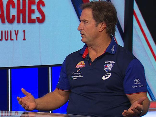 Mark Robinson and Luke Beveridge engaged in a tense debate.