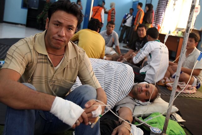 <p>Survivors of the Indonesian boat tragedy. Picture: Lukman Bintoro</p>