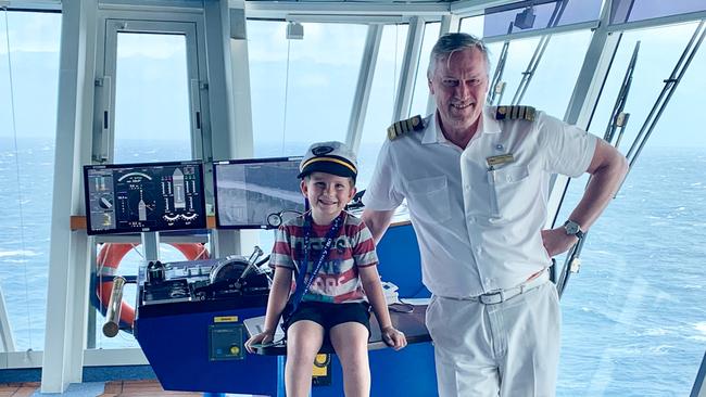 The writer’s son with the ship’s captain. Picture: Angela Saurine.