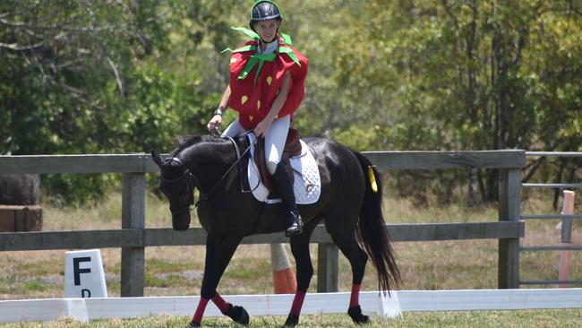 Abigail Lee as the Strawberry from the Very Hungry Caterpillar competing at Mackay North Pony Club's dressage teams competition, November 6, 2021. Picture: Matthew Forrest