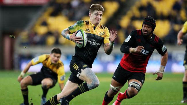 Jordie Barrett of the Hurricanes breaks away for a try at Westpac Stadium.