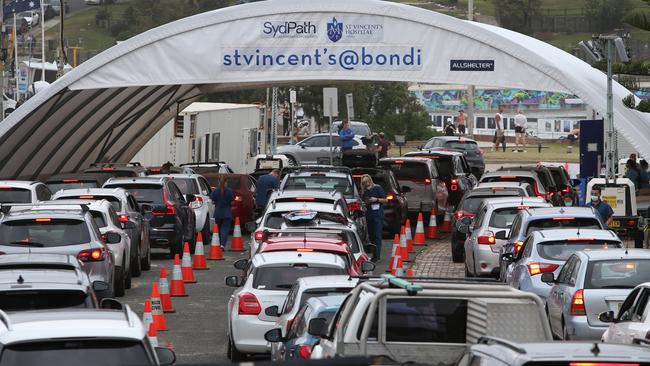 Hundreds of people queue at the St Vincent's Bondi Beach drive through clinic at the height of the testing rush before Christmas. Picture: Lisa Maree Williams/Getty Images