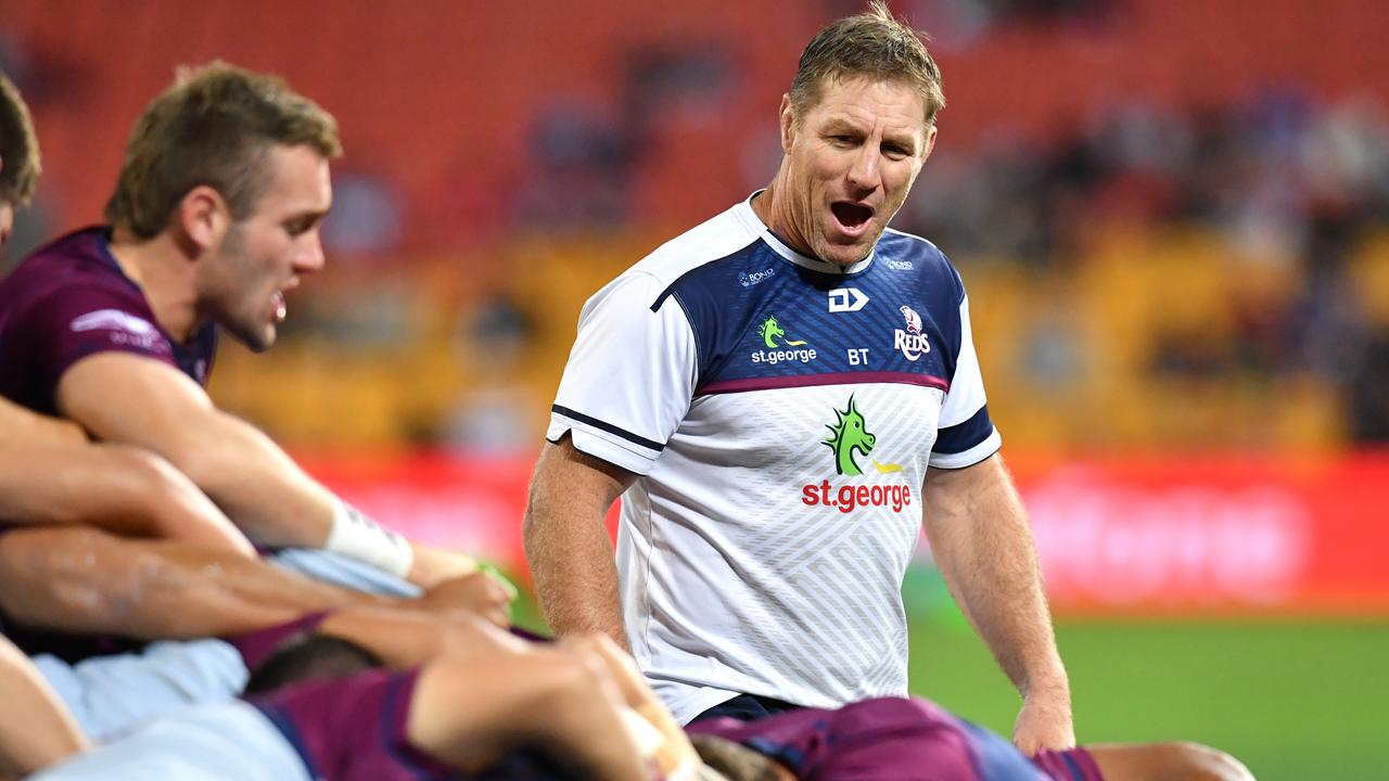 Reds coach Brad Thorn as his team warms up at Suncorp Stadium in Brisbane.