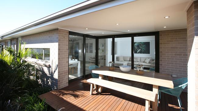 A covered outdoor space completes the living areas of the home and offers valuable extra space for entertaining..