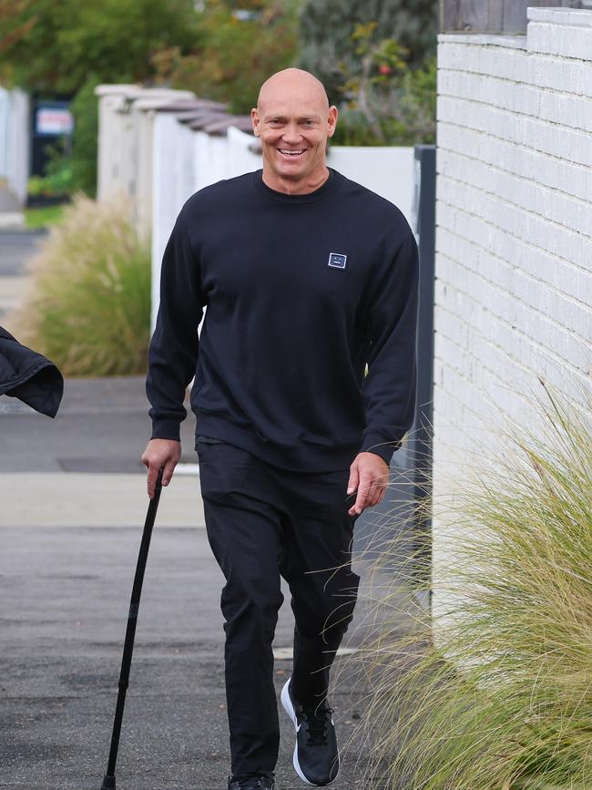 Michael Klimwalking with his family while using a walking stick. Picture: Brendan Beckett