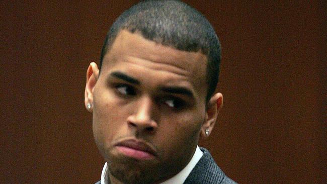 R&B singer Chris Brown listens to the court proceedings as he is arraigned on assault charges in the Los Angeles Superior Court on March 5, 2009. Brown was charged with assaulting his pop-star girlfriend Rihanna as gruesome details about the alleged attack emerged for the first time. Brown, 19, appeared in court for arraignment on the charges, which came after he allegedly subjected Barbados-born Rihanna to a savage beating in the early hours of February 8. The incident shocked the music world and left Rihanna nursing cuts and bruises to her face, forcing her to cancel a scheduled performance at the Grammy Awards in Los Angeles later February 8. POOL/BOB CHAMBERLAIN