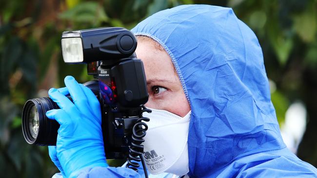 An investigator at the former Cardiff chicken processing plant which has been cordoned off by police. Picture: Peter Lorimer.