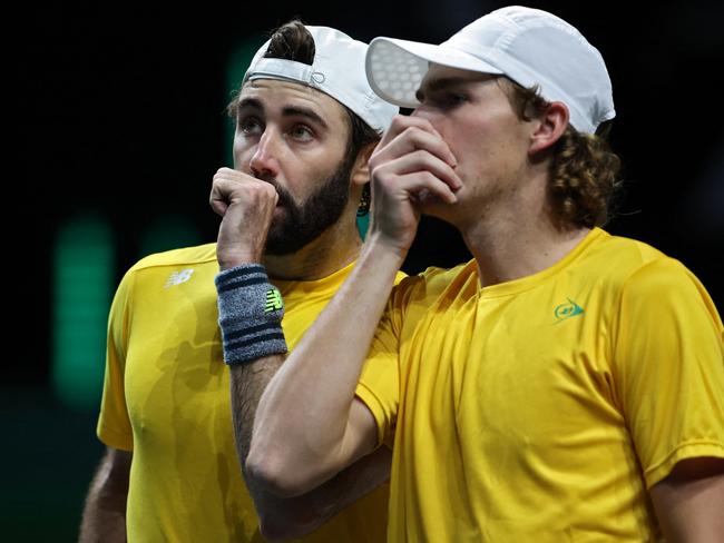 Australia's Jordan Thompson (L) and Australia's Max Purcell talk during the men's double Davis Cup semi-final tennis match between Australia and Croatia at the Martin Carpena sportshall, in Malaga on November 25, 2022. (Photo by Thomas COEX / AFP)