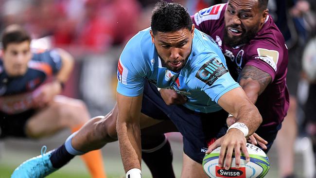 Curtis Rona reaches out to score for the Waratahs against the Reds last year. Picture: Getty Images