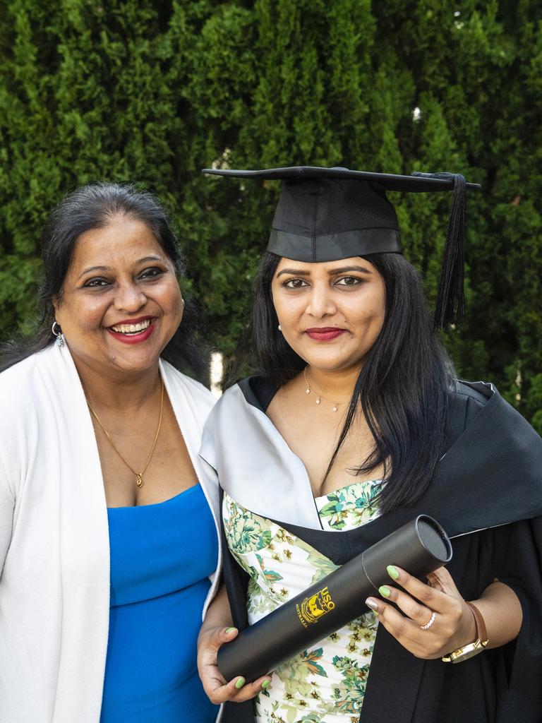 Graduate Diploma of Business graduate Darshna Sahay with Gauri Samant at the UniSQ graduation ceremony at Empire Theatres, Tuesday, December 13, 2022. Picture: Kevin Farmer