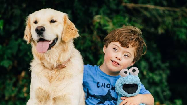 Koa with the family dog, Louie. Picture: Robert Lang