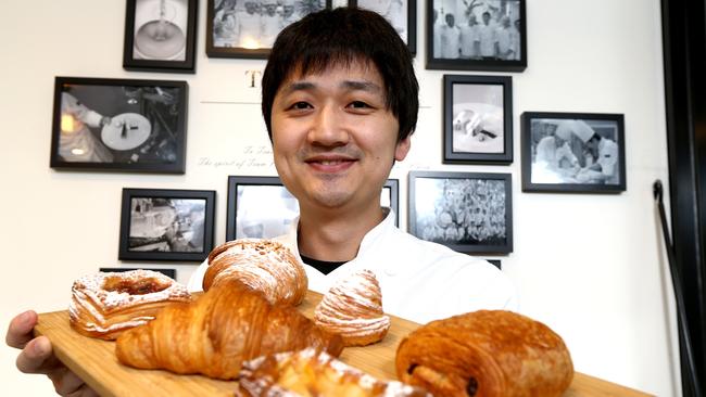 Pastry chef Justin Yu is the owner of The Whisk at Upper Mount Gravatt, his pastries are so popular he usually sells out before lunchtime. Picture: AAP/David Clark