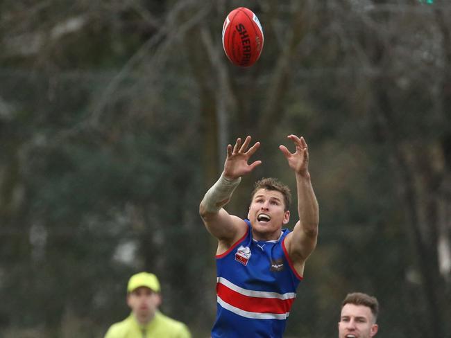 Dale Walker goes up for a mark. Picture: Stuart Milligan