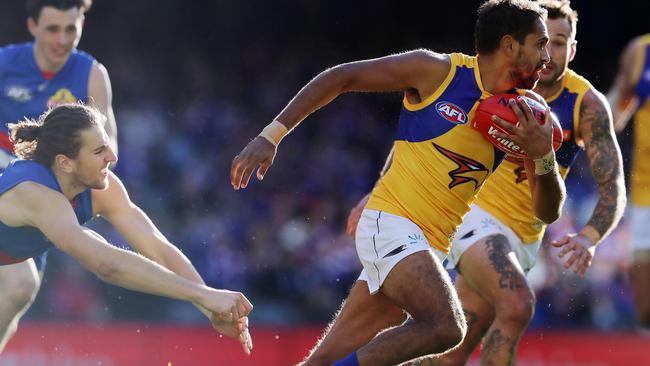 Lewis Jetta breaks the Marcus Bontempelli tackle. Picture: Michael Klein