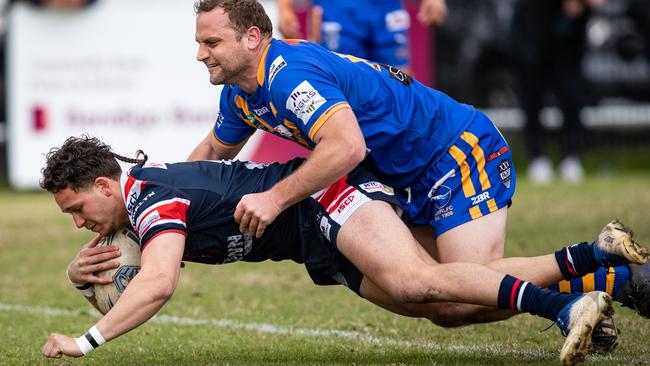 Kienan Tempest scores the first of his three tries. News Local, Pictures by Julian Andrews.