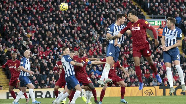 Liverpool defender Virgil van Dijk, second from right, scores his second goal against Brighton at Anfield. Picture: AP