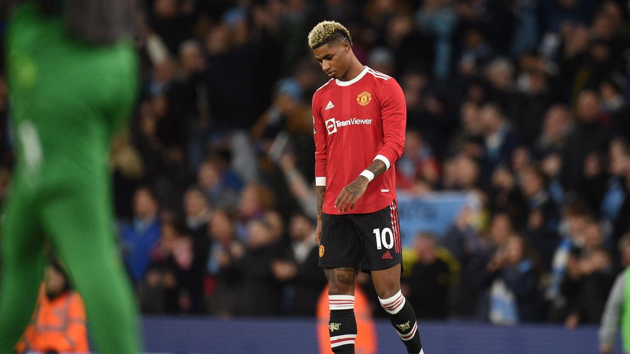 Manchester United's English striker Marcus Rashford reacts to their defeat on the pitch after the English Premier League football match between Manchester City and Manchester United.