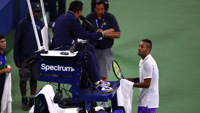 Nick Kyrgios takes on the chair umpire during his first-round match. Picture: AFP