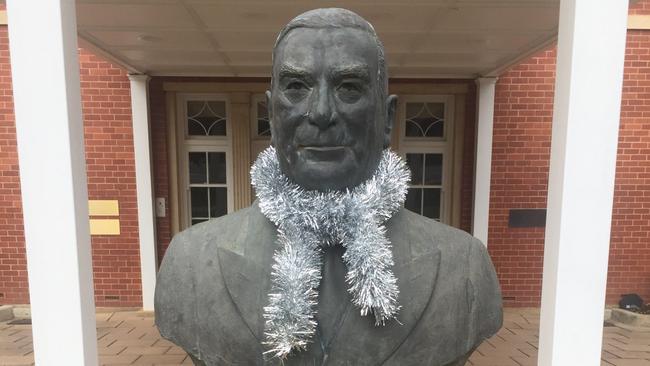 Robert Menzies’ bust gets the festive treatment outside Menzies House, Canberra.   Picture: Rosie Lewis 