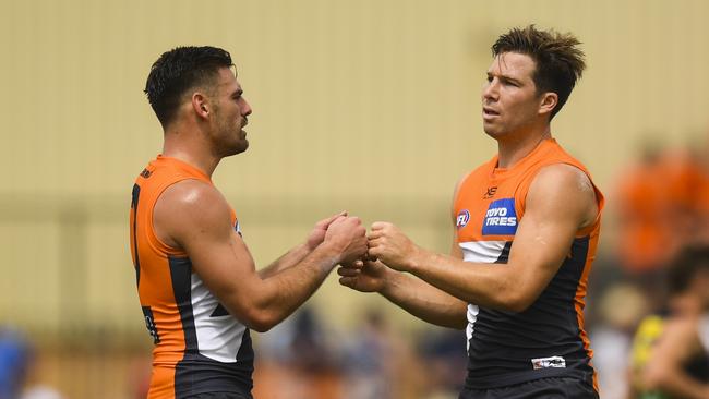 Stephen Coniglio and Toby Greene celebrate a Giants goal. Picture: AAP Image/Lukas Coch