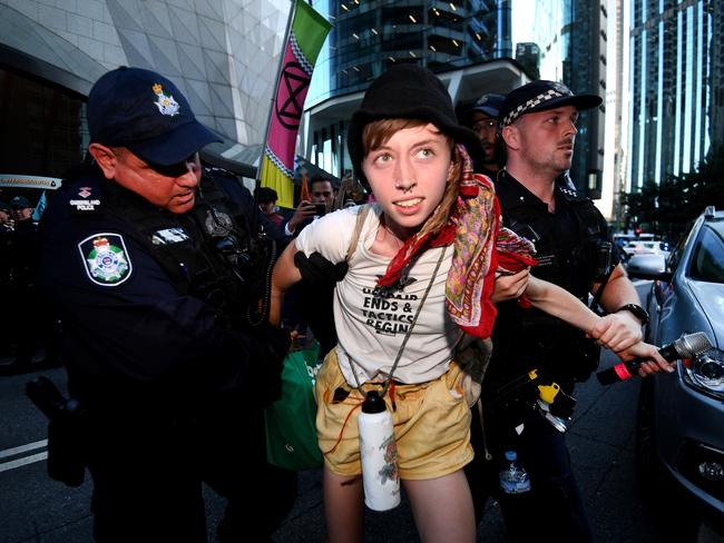 A protester is arrested at the Extinction Rebellion protest in Brisbane. Picture: Dan Peled/NCA NewsWire