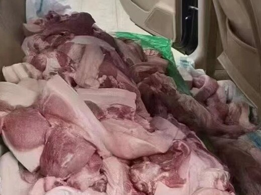 This car was packed full of pork as residents stock up. Picture: Twitter